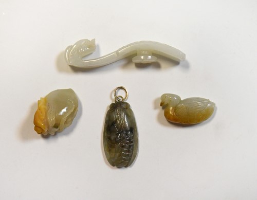 Lot 63 - A Chinese white jade belt hook in archaic style, Qing Dynasty