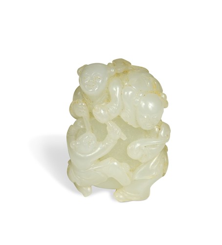 Lot 146 - A Chinese light celadon jade carving of three boys and drum, Qing Dynasty 18th/19th century