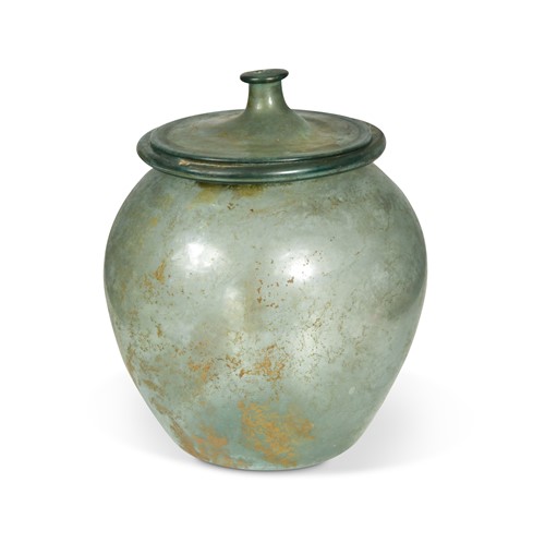 Lot 426 - A Roman blue-green glass cinerary urn and cover, 1st-2nd century AD