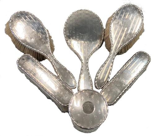 Lot 305 - An early 20th century silver backed six-piece dressing table set