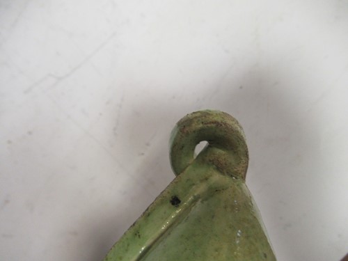 Lot 34 - A green glazed pottery 'pig' form money box,...