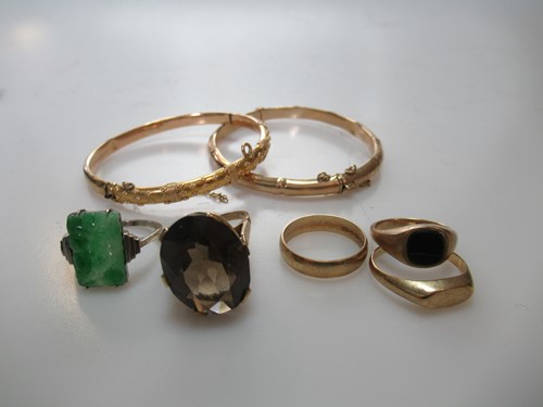Lot 305 - A hallmarked 9ct gold bangle, a bangle tested...
