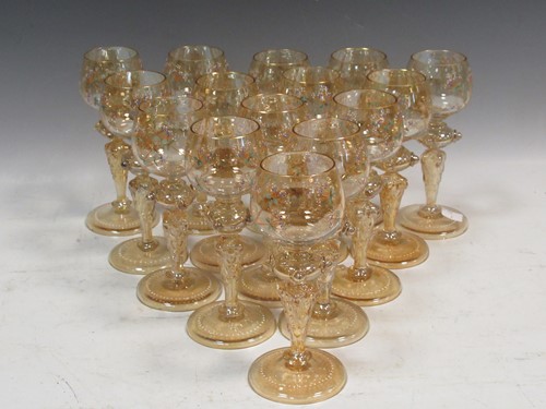 Lot 11 - A set of 15 iridescent glass & enamelled white...