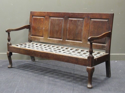 Lot 729 - A George III oak settle