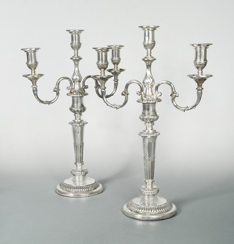 Lot 391 - Two George III silver candlesticks with a pair of later 3 light branches