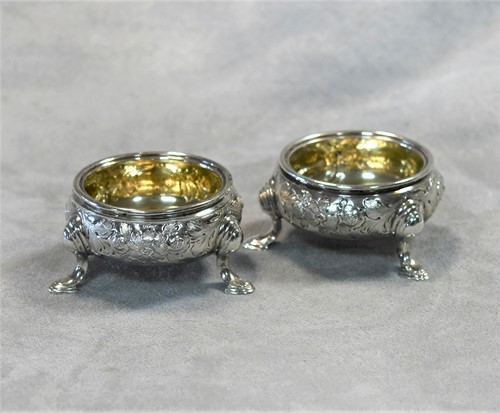 Lot 369 - A pair of George II silver cauldron salts
