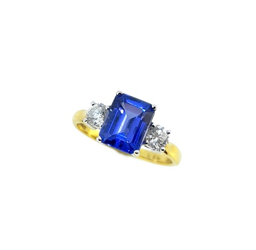 Lot 70 - An 18ct gold tanzanite and diamond three stone ring