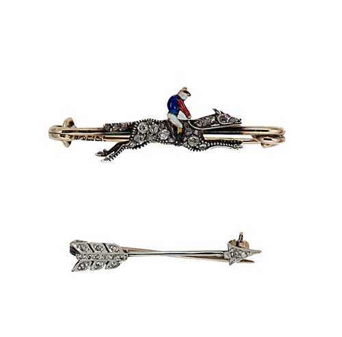 Lot 118 - A diamond jockey brooch together with a diamond arrow brooch