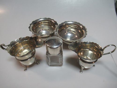 Lot 345 - Two silver milk jugs, two silver sugar bowls...