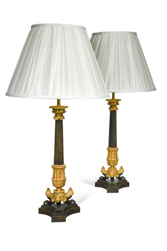 Lot 809 - A large pair of bronze and ormolu triform candlestick lamps
