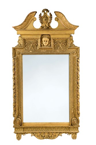 Lot 752 - A George II and later carved giltwood wall mirror