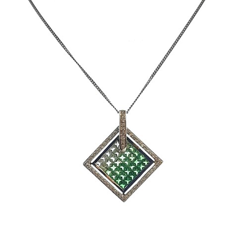 Lot 102 - A tsavorite garnet and diamond pendant and chain