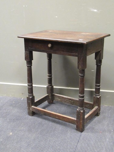 Lot 640 - An 18th century oak side table fitted one...