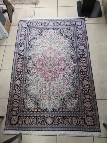 Lot 773 - A modern Persian part silk rug, 190 x 123 and...