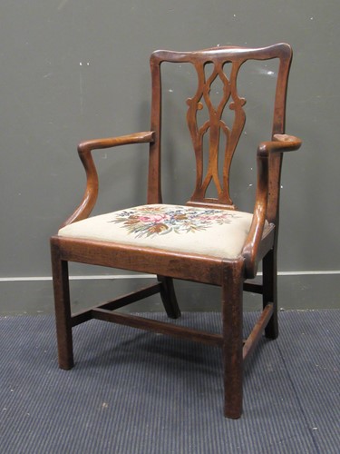 Lot 635 - An early 19th century elbow chair with pierced...