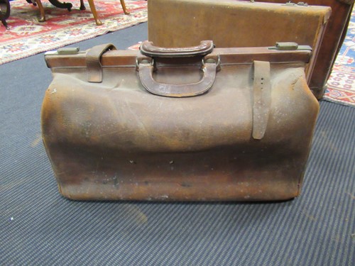 Lot 173 - A leather gladstone bag, two other leather...