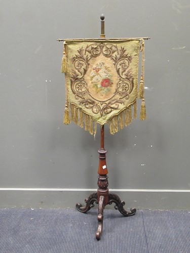 Lot 630 - A Victorian rosewood pole screen with...