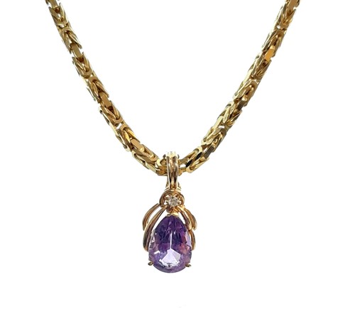 Lot 115 - An amethyst and diamond pendant and chain