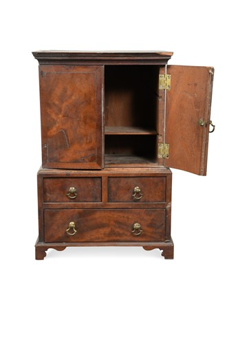 Lot 844 - A miniature mahogany linen press, 19th century