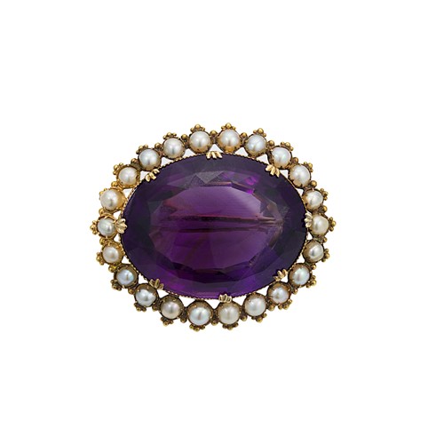 Lot 120 - A Victorian large amethyst and split pearl brooch