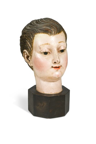 Lot 706 - A Spanish polychrome painted carved wood head of a boy, 19th century