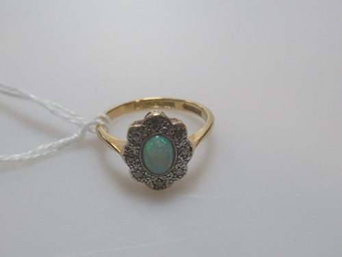 Lot 300 - An opal and diamond cluster ring, unhallmarked,...
