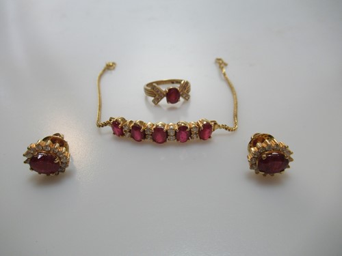 Lot 304 - A glass filled ruby and diamond ring, stamped '...