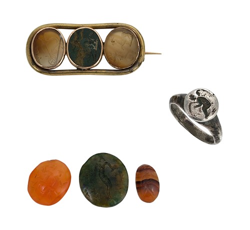 Lot 133 - A Georgian intaglio brooch together with a group of intaglios and a ring