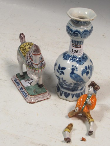 Lot 186 - Deflt polychrome figure of a rider; together...