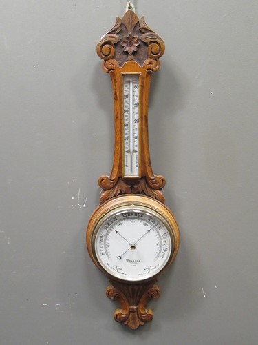Lot 717 - A Victorian wheel barometer by Dollond, London