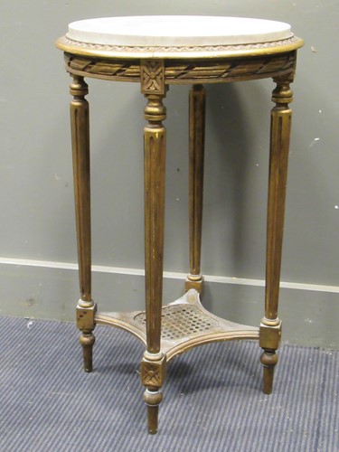 Lot 594 - A marbled topped gilt side table on tapering...