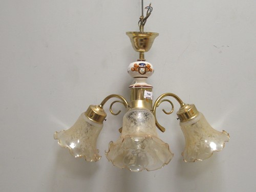 Lot 744 - A metal and ceramic drop chandelier, approx...