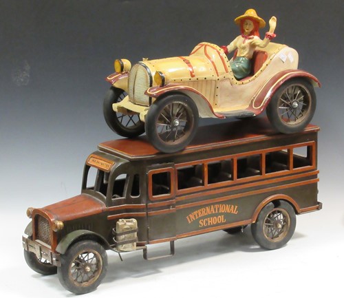 Lot 166 - A painted wooden model Washington school bus...