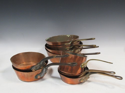 Lot 165 - An assortment of 9 copper pans