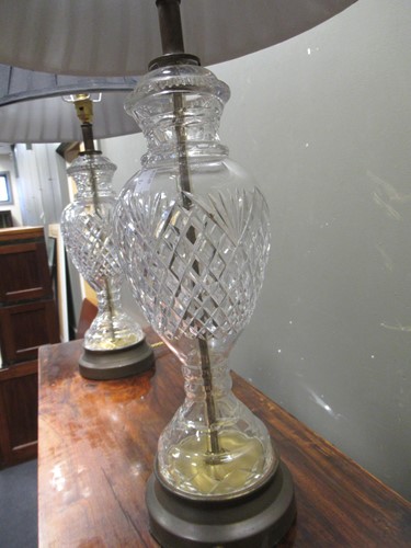 Lot 656 - A pair of cut glass lamp bases, with shades