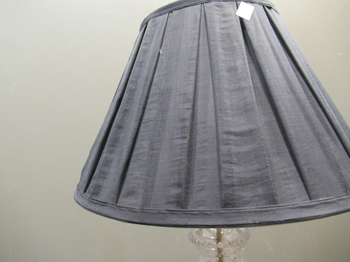 Lot 656 - A pair of cut glass lamp bases, with shades