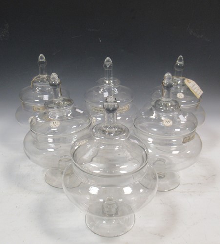 Lot 282 - A set of English glass apothecry lidded jars...