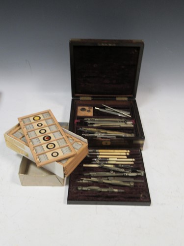 Lot 140 - A rosewood case of drawing instruments and box...