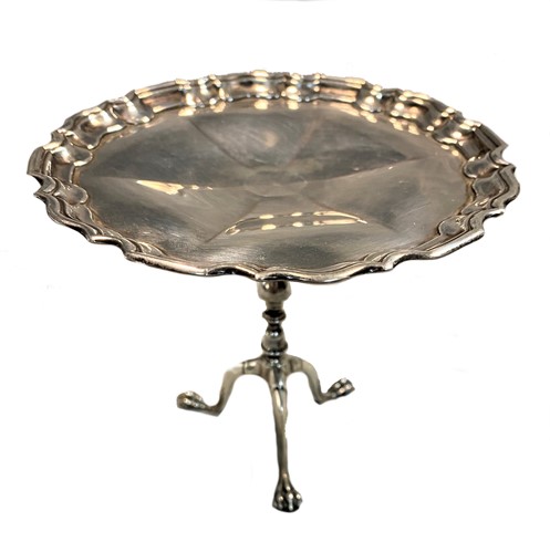 Lot 325 - An early 20th century silver miniature tripod wine table