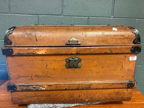 Lot 286 - An early 20th century painted tin trunk with...