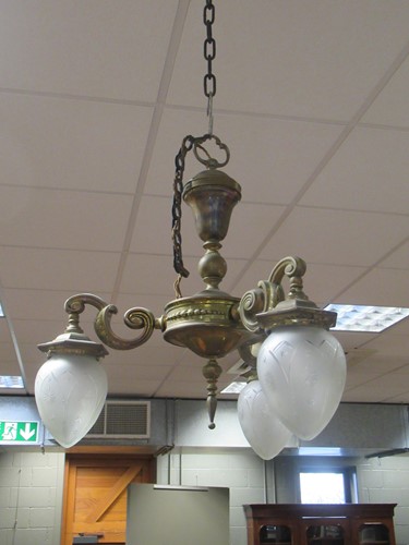 Lot 629 - Two brass three branch chandaliers with glass...