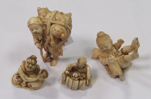 Lot 137 - Four ivory netsukes, one of a rat catcher -...