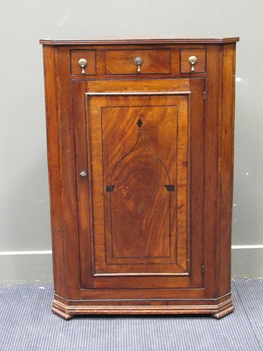 Lot 669 - A 19th century floor standing corner cupboard,...