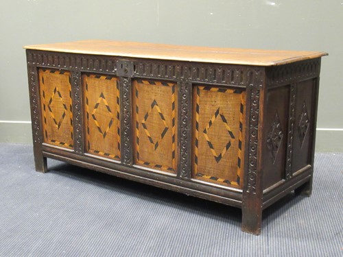 Lot 579 - A 19th century carved and inlaid oak coffer...