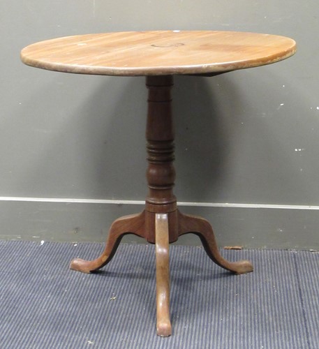 Lot 573 - A 19th century tilt top tripod table, the...