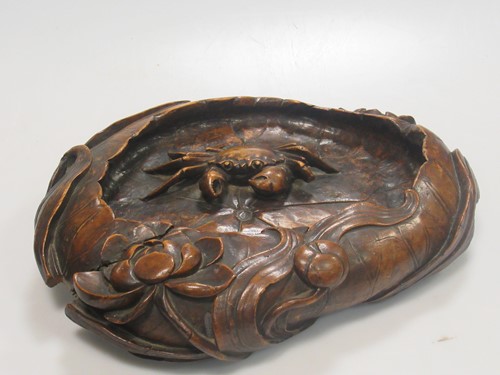 Lot 202 - A carved wood Japanese dish of a crab in a...