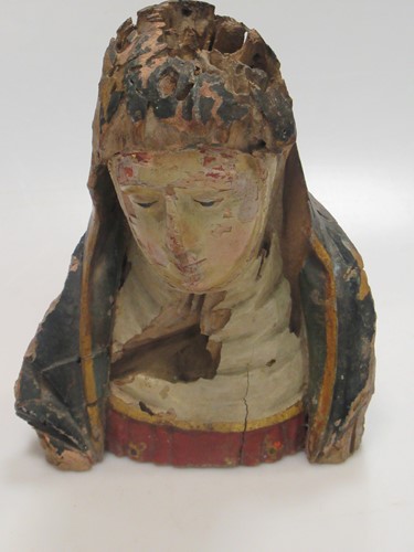 Lot 203 - A carved and painted wooded head of a Madonna,...