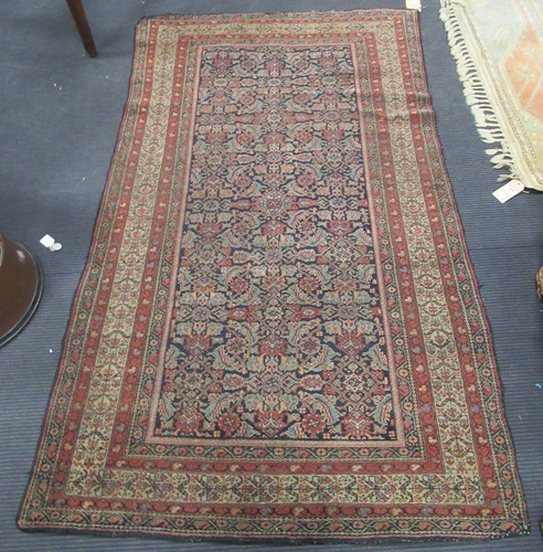 Lot 783 - A Feraghan rug with stylised foliate motifs on...