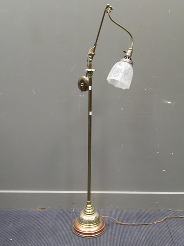 Lot 654 - An Edwardian brass cantaliver reading lamp...