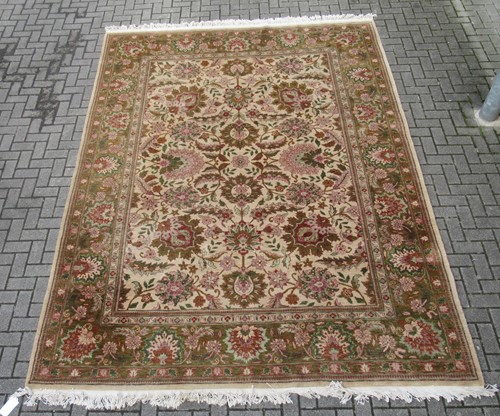 Lot 604 - A modern Chinese wool carpet with floral...